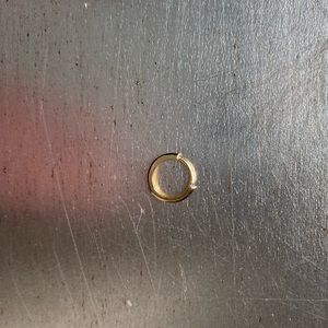 Small single 14K gold hoop earring